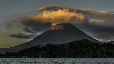 Costa Rica · Volcano + Coast: Arenal hot springs, wetland safari, and Santa Teresa surf culture.